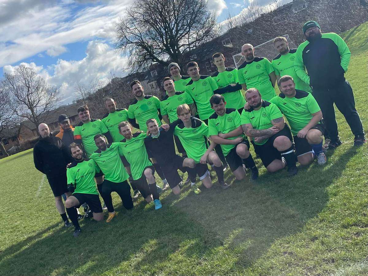 Sheffield Seven Hills AFC team photo, pictured before a match wearing the green home kit, sponsored by Irwin Mitchell